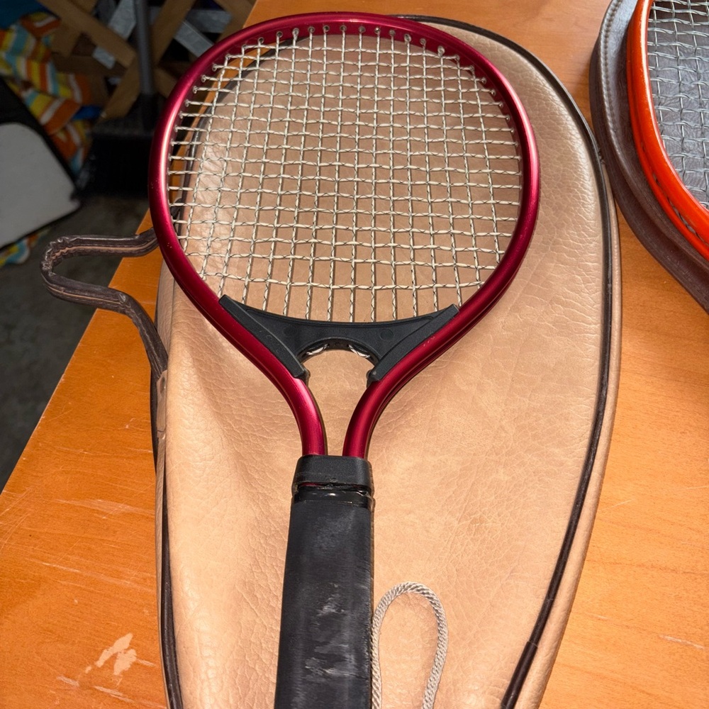 Elegant Burgundy Raquetball Racket with Black Handle